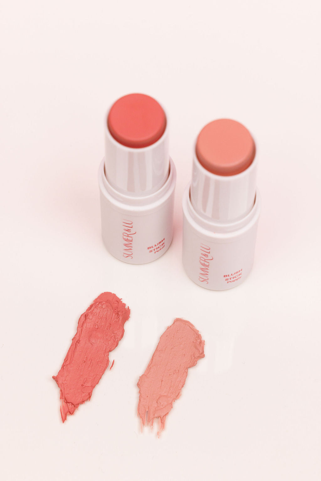 Creamy Blush Stick in Poppy, soft fresh pink shade for a natural everyday glow