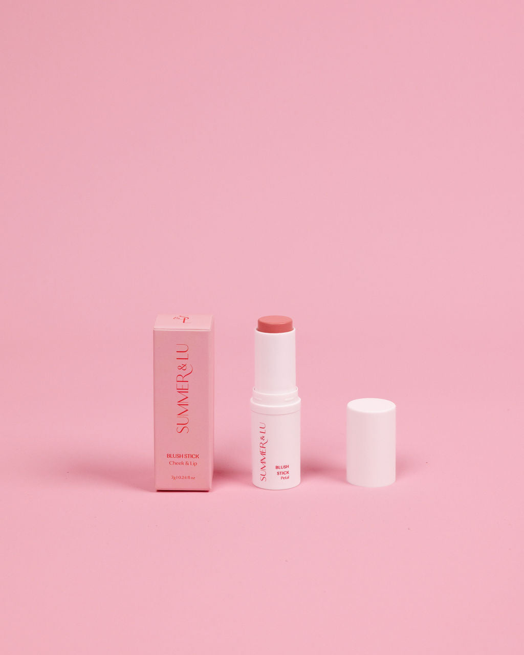 Creamy Blush Stick in Petal Pop shade, vibrant pink for bold statement look